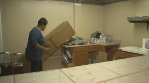 Pastor Mona Harper surveys the damage at Kingdom City Church in Stone Mountain, Ga.